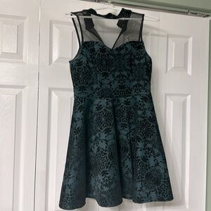 Green and black velvet dress